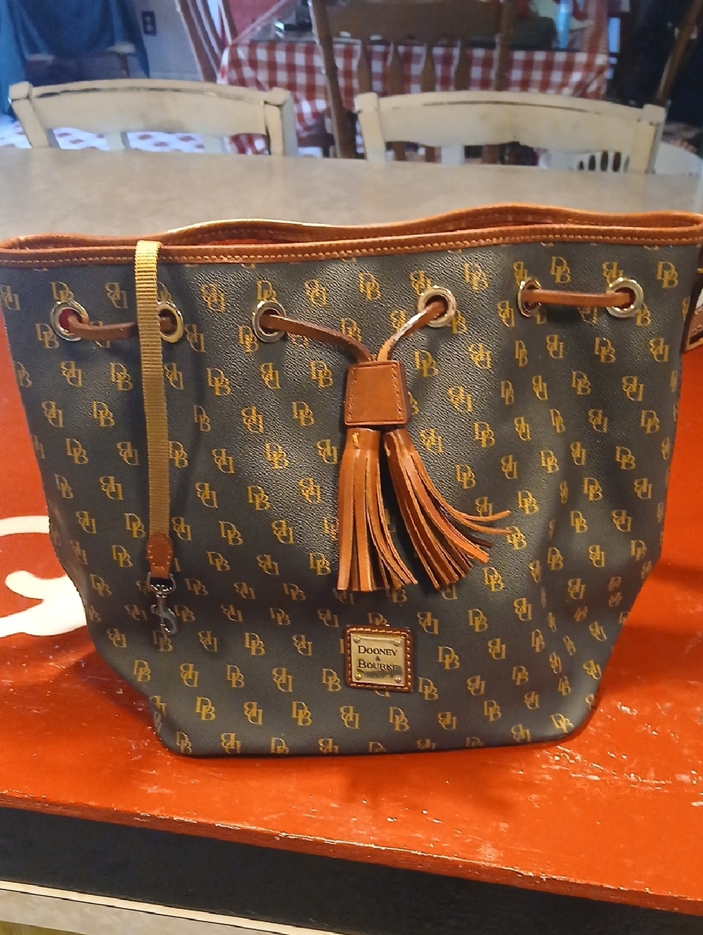 Dooney & Bourke Brown and Tan Logo Drawstring Crossbody Bag